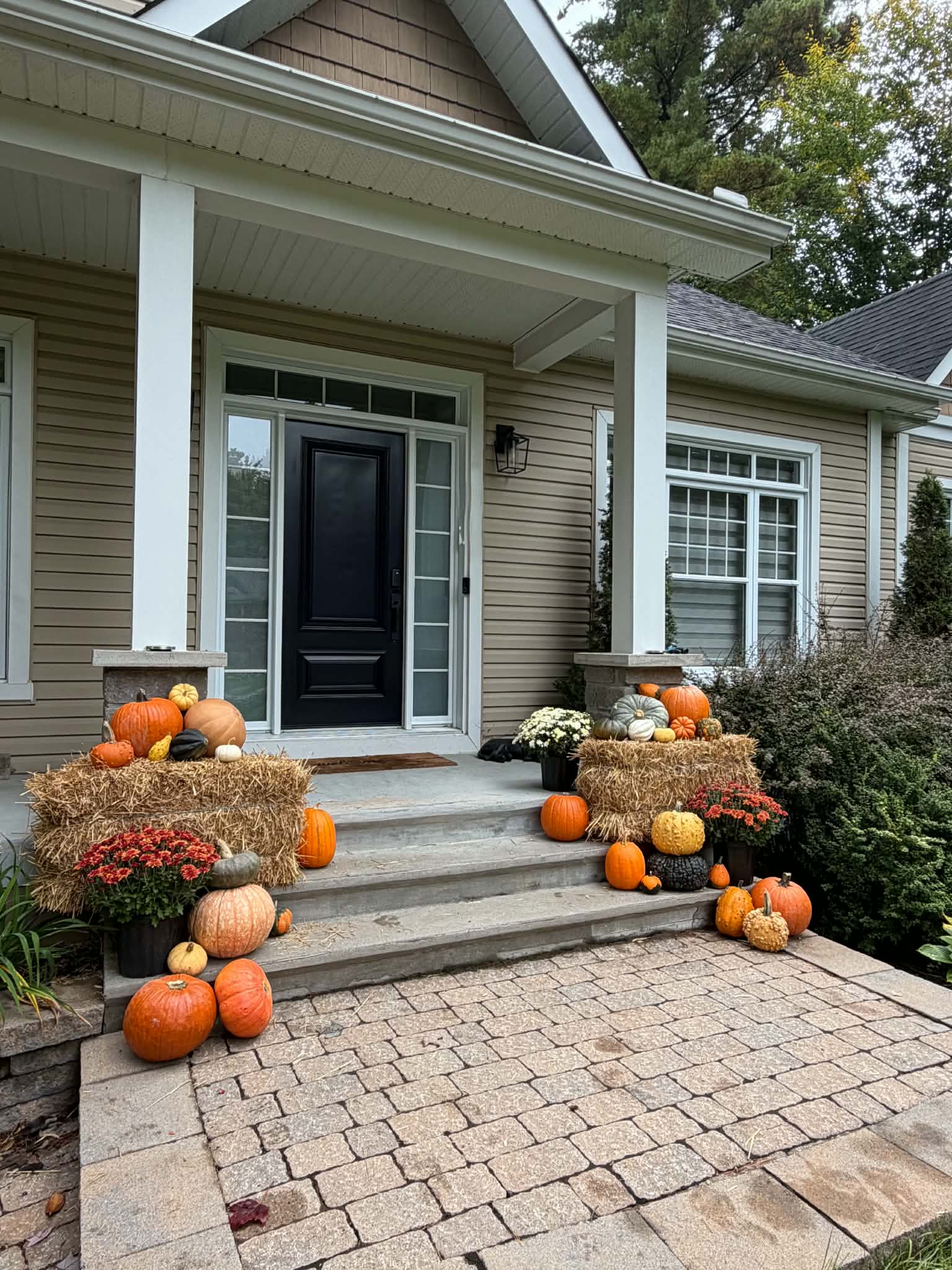 Grand estate custom pumpkin facade styling and botanical entrance for gated residence in Senneville